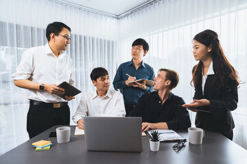 Group of diverse office worker employee working together on strategic business marketing planning in corporate office room. Positive teamwork in business workplace concept. Prudent