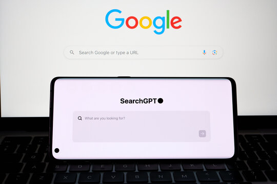 SearchGPT page seen on the smartphone screen and Google search on the background. Concept for competition. Stafford, United Kingdom, July 31, 2024