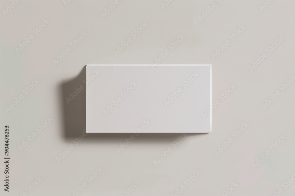 Aufkleber a plain, white rectangular box shown with a soft shadow against a gentle backdrop, representing simp