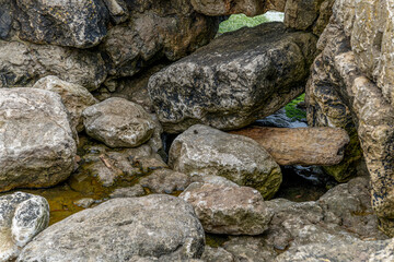 Captivating view of historic stone ruins perched on a rugged cliff in Cantabria, Spain, with the ocean in the background. Ideal for travel, history, and landscape themes.