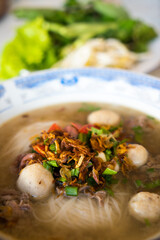 Authentic Lao Noodle Soup with Flavorful Meatballs, Onions and Fresh Herbs - A Taste of Traditional Lao and northern Thai Cuisine (Kuay Tiew, Khao Piak Sen or Kuay Teow) © Arsene Maurice
