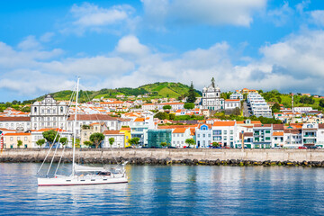 View of Horta town with white houses and church on coast of Faial island, Azores, Portugal