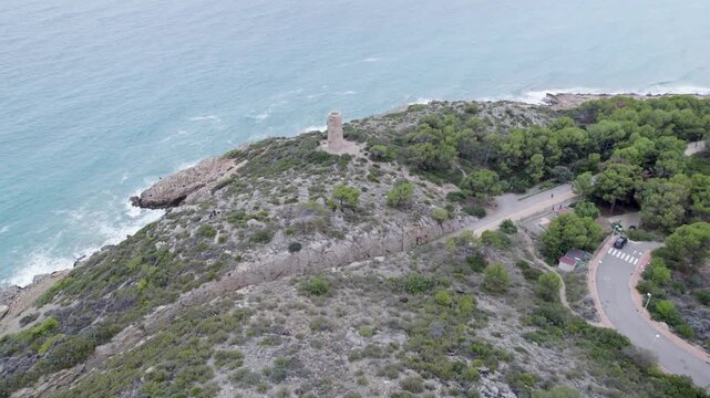 Slow aerial view of Torre de la Corda and Via Verde in Oropesa del Mar, Spain