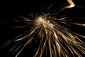 sparks from the grinder glowing in the dark
