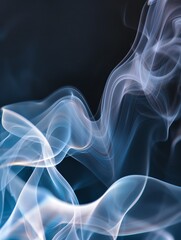 Fototapeta premium Elegant wisps of smoke gracefully dance in the air, creating an ethereal atmosphere against a dark backdrop.