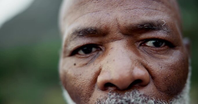 Black man, face and closeup of eyes outdoor for fitness, retirement and hiking with commitment in morning. Mature person, portrait and serious in nature with determination for workout and exercise