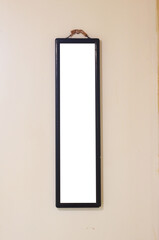 blank sign hangs on the wall.