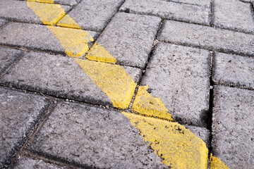 yellow line on  paving stone