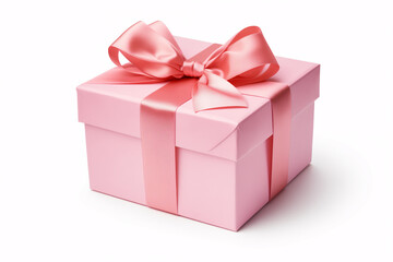 Fototapeta premium A pink gift box with a large pink bow on top, isolated on a white background.