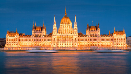 Hungarian parliament building with passing boat