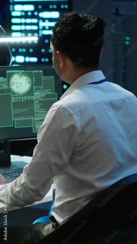 Poster vertical video team of technicians in server hub alerted by hacker passing firewall and stealing sen