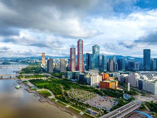 Yeouido, Yeongdeungpo-gu, Seoul, South Korea - August 13, 2022: Aerial view of Han River and Hangang Citizens Park with Full Gospel Church against high-rise buildings of financial district
