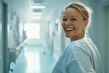 Fototapeta premium Happy confident female doctor nurse in scrub portrait hospital background Medicine Healthcare banner 