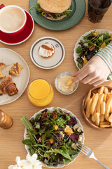 The lifestyle of gourmets. Different dishes on a wooden table. The concept of lunch, restaurant