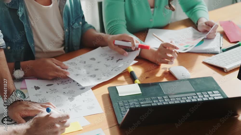 Poster close up of smart business team hands looking at color palette at table while throw paper in the air
