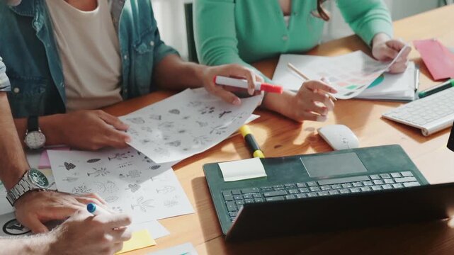 Close up of smart business team hands looking at color palette at table while throw paper in the air. Group of interior design talking and discussing about successful idea and celebrating. Symposium.