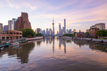 Naklejka premium view of shanghai skyline and bridge at sunrise