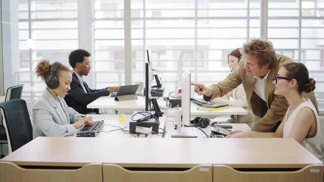 In a collaborative office setting, employees work as a team to engage in productive activities with the aid of technology and achieve success. This involves interaction, innovation, and teamwork