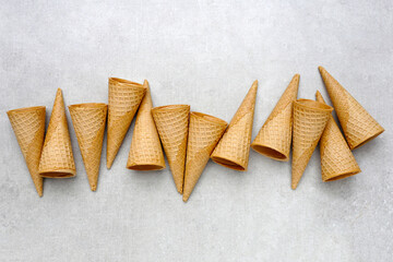 Waffle cones on grey background