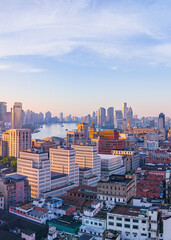 Fototapeta premium Aerial view of modern city skyline and buildings at sunrise in Shanghai.