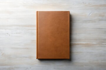Brown Leather Bound Notebook on Wooden Surface.