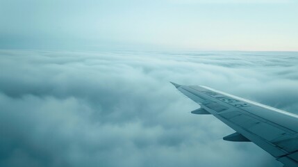 Airplane Wing Above the Clouds