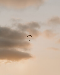 paraglider in the sky at sunset