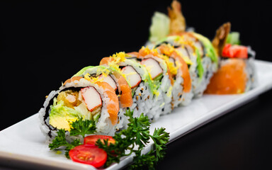 Dynamite roll topped with salmon