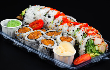Dynamite sushi roll with spicy salmon roll