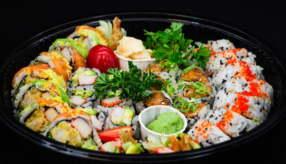 6 pieces of California rolls, 6 pieces of Spicy Salmon rolls, 10 pieces of Dynamite rolls, and 10 pieces of Red Dragon rolls