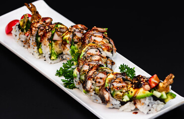 Dynamite roll topped with grilled eel