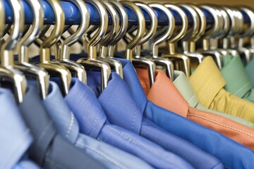 Fototapeta premium Colorful clothes hangers with padlocks, symbolizing secure storage and protection in a vibrant, organized setting.