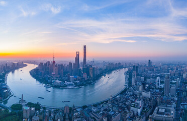 Obraz premium Aerial view of modern city skyline and buildings at sunrise in Shanghai.