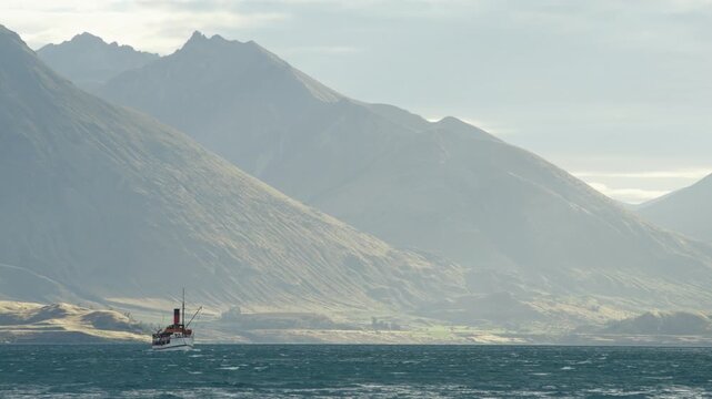 Late afternoon shot of TSS Earnslaw crossing Lake Whakatipu with pastel colours A.