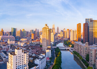 Obraz premium Aerial view of modern city skyline and buildings at sunrise in Shanghai.