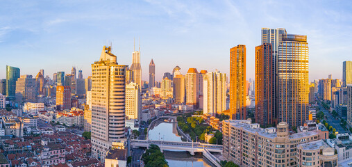 Obraz premium Aerial view of modern city skyline and buildings at sunrise in Shanghai.
