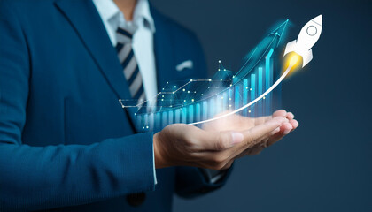 Startup business concept, Businessman hold with virtual rocket icon and up arrow aiming targ
