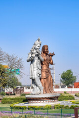 Fototapeta premium Big statue of Lord Radha Krishna near Delhi International airport, Delhi, India, Lord Krishna and Radha big statue touching sky at main highway Mahipalpur, Delhi