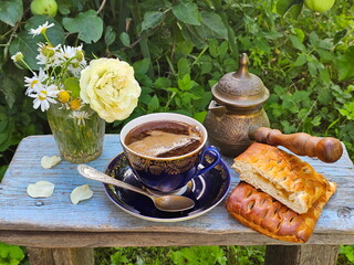 Coffee with layered cake on wooden background