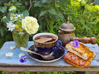 Coffee with layered cake on wooden background