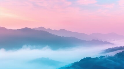Fototapeta premium Dawn breaks with pastel hues illuminating mist-covered mountains, creating a tranquil, ethereal atmosphere