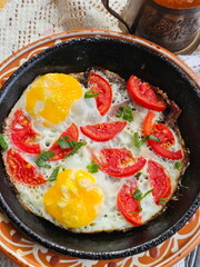 Berry pancakes and fried eggs with lemon tea