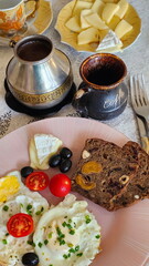 Scrambled eggs with tomatoes and natural coffee