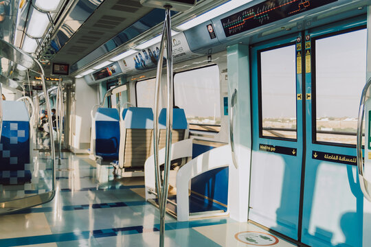 Dubai, UAE - October 6, 2020: RTA Dubai public metro interior of train with empty seats and navigation