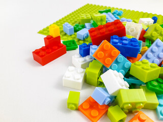 Various colored toy blocks on a white background. Educational toys for children