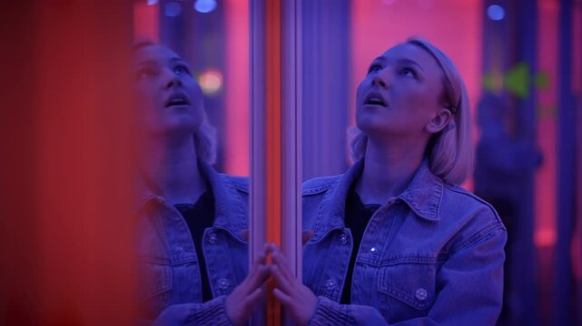 A woman contemplates in neon lights, embracing urban aesthetic, deep reflections, and modern vibes