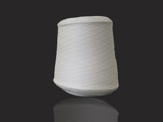White bobbin of thread.