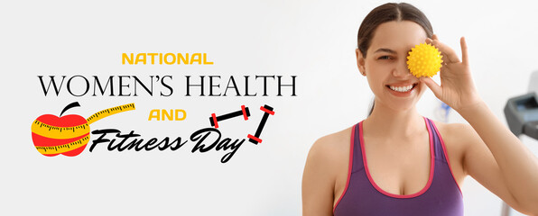 Obraz premium Sporty young woman with massage ball at gym, closeup