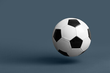 Naklejka premium Soccer ball on dark background