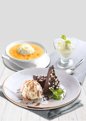 ice cold cute yellow mango pomelo fruit pudding jelly on plate with vanilla ice cream chocolate brownie cake fruit decor sweet western dessert cafe halal restaurant kids menu set
